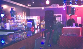 Facing the entrance and the DJ left is the bar